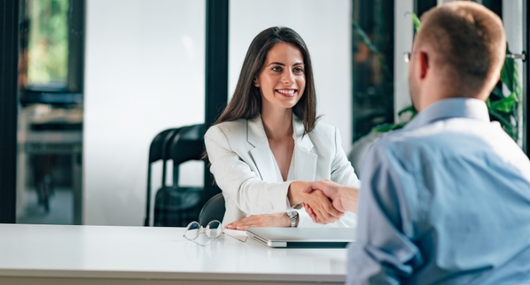 HR consultant reviewing personnel files for a compliance check