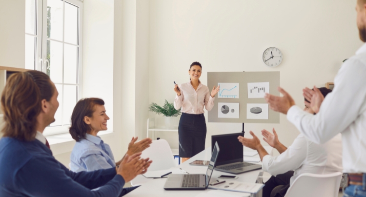HRIS dashboard displayed on a laptop in an office environment